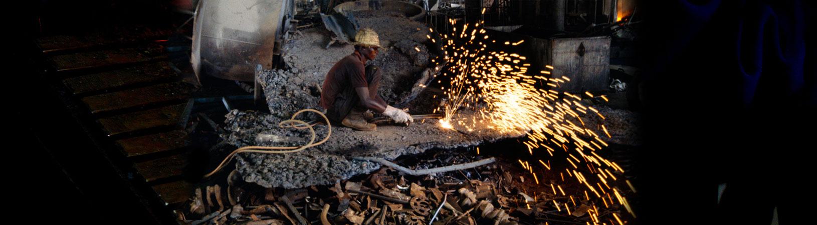metal worker using electric equipment uganda