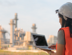  female_engineer_wearing_hard_hat_with_laptop_at_power_plant